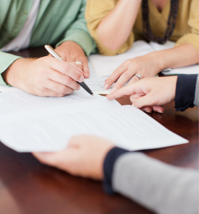 lawyer and client hands with a prenup document
