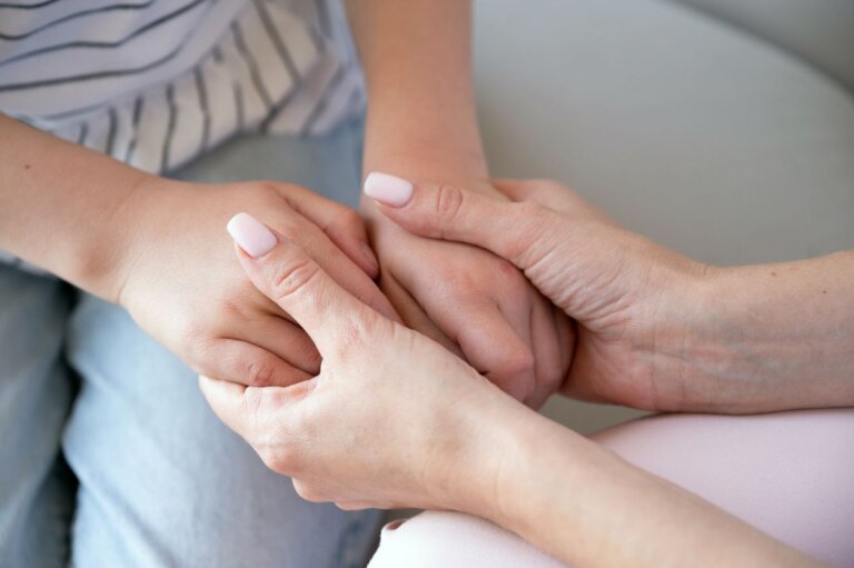 mother holding childs hands